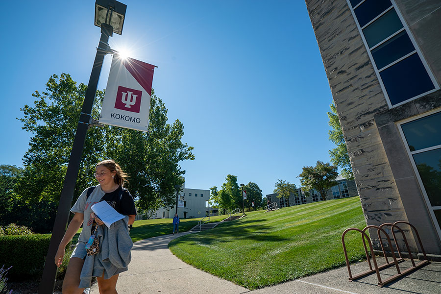 Student walking on IU Kokomo campus.