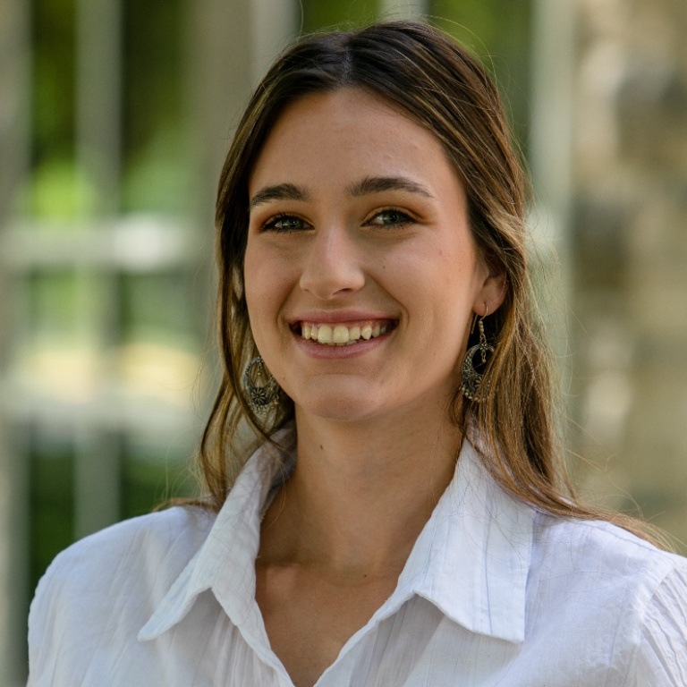 a female student in wearing a white shirt