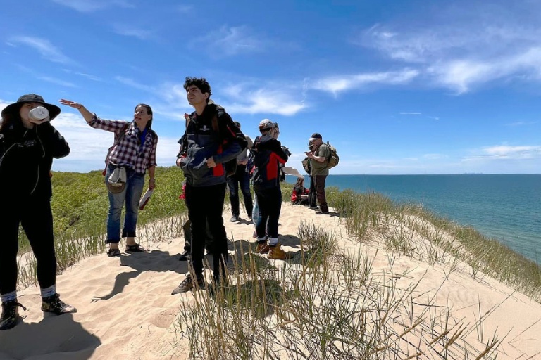 Students and faculty overlooking Indiana Dunes
